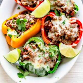 rainbow stuffed peppers on a white plate