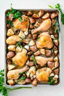 roasted chicken and potatoes on baking sheet
