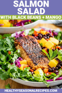 blackened salmon salad with black beans and mango over a bed of greens