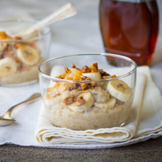 steel cut oats with bananas in a glass bowl
