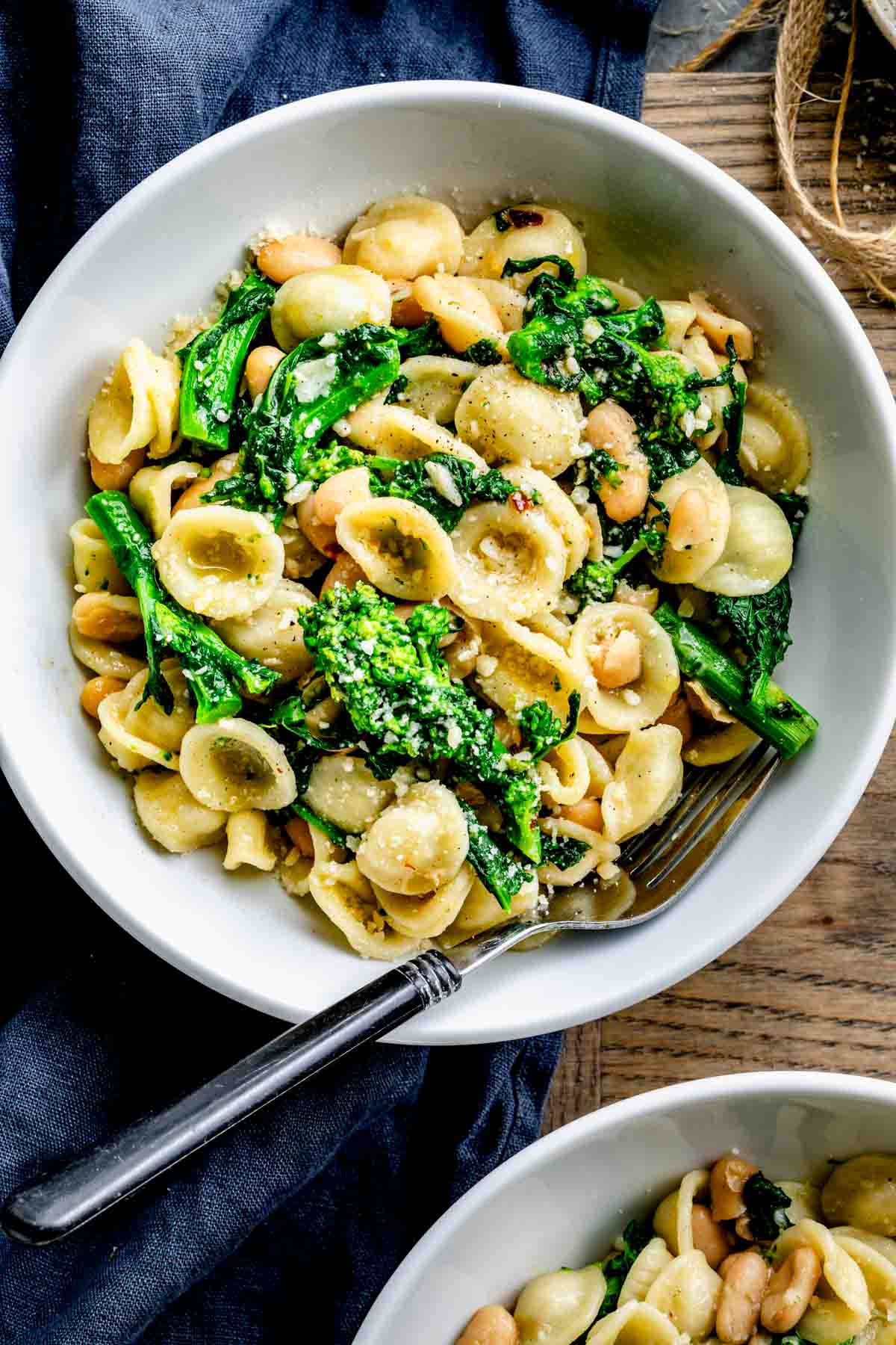 broccoli rabe with pasta in circular white bowl with a s،