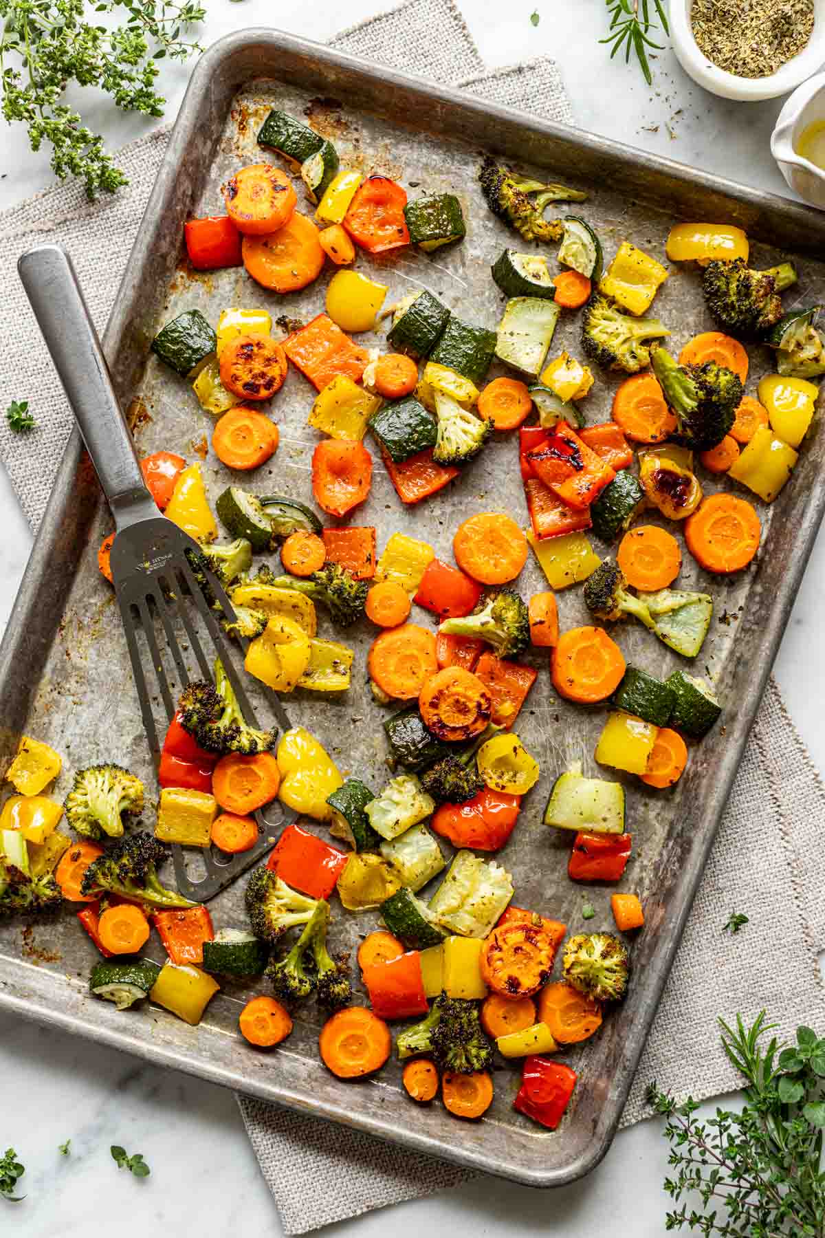 a sheet pan with roasted vegetables on it