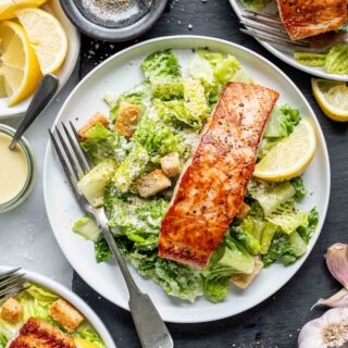 the salmon caesar on a white plate
