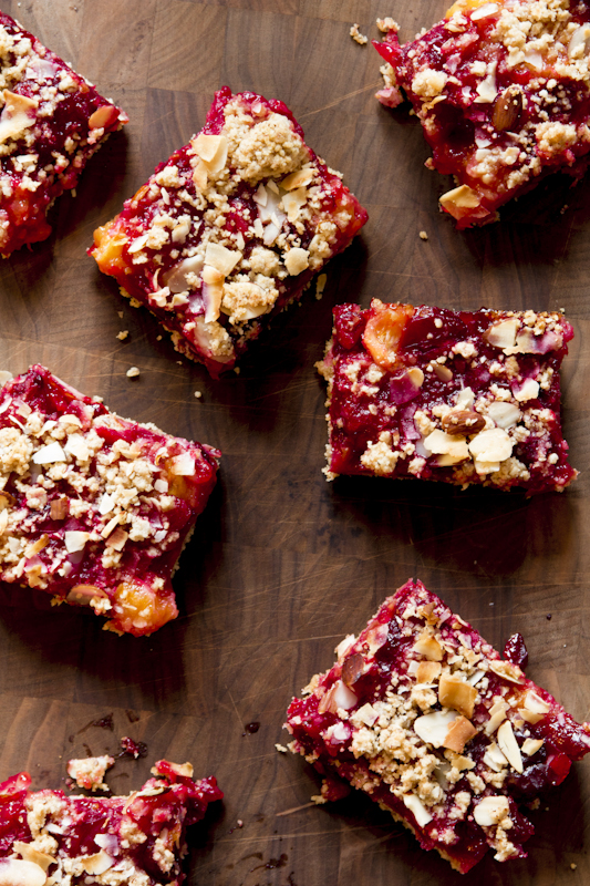 cranberry bars on a wooden board